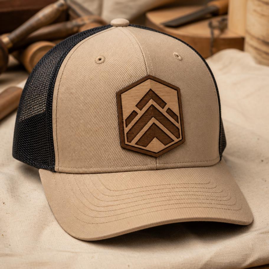 Tan structured trucker hat with an engraved hardwood patch